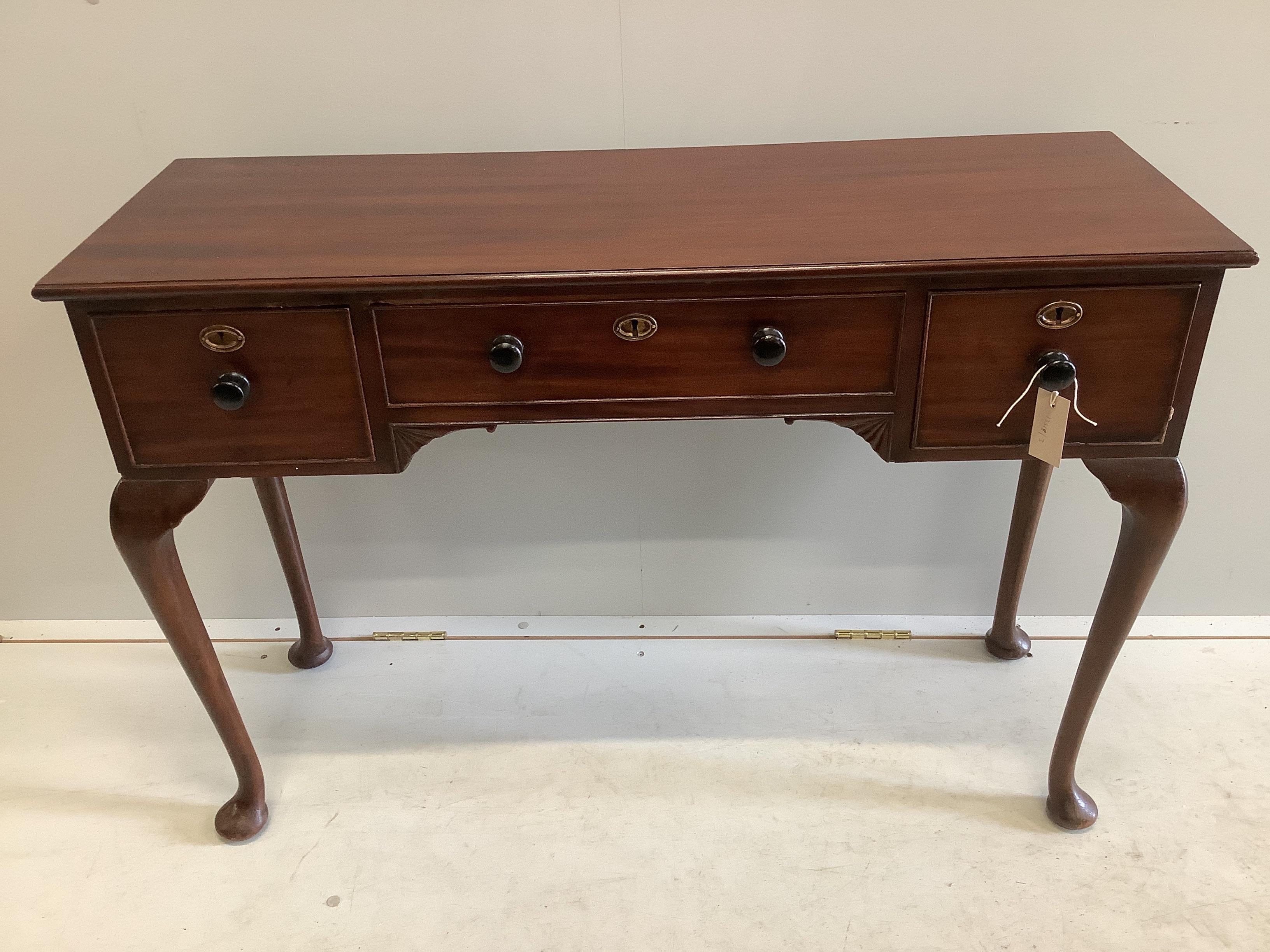 A mahogany three drawer console table, width 105cm, depth 36cm, height 73cm